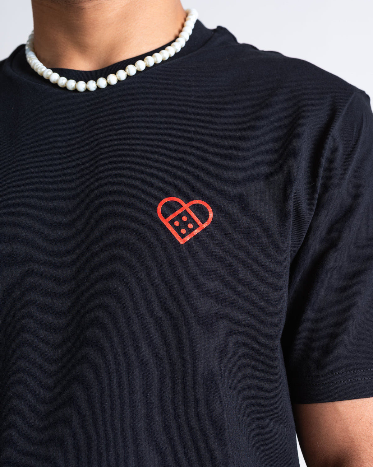T-Shirt «Pflasterherz» Schwarz: Detail des Motivs